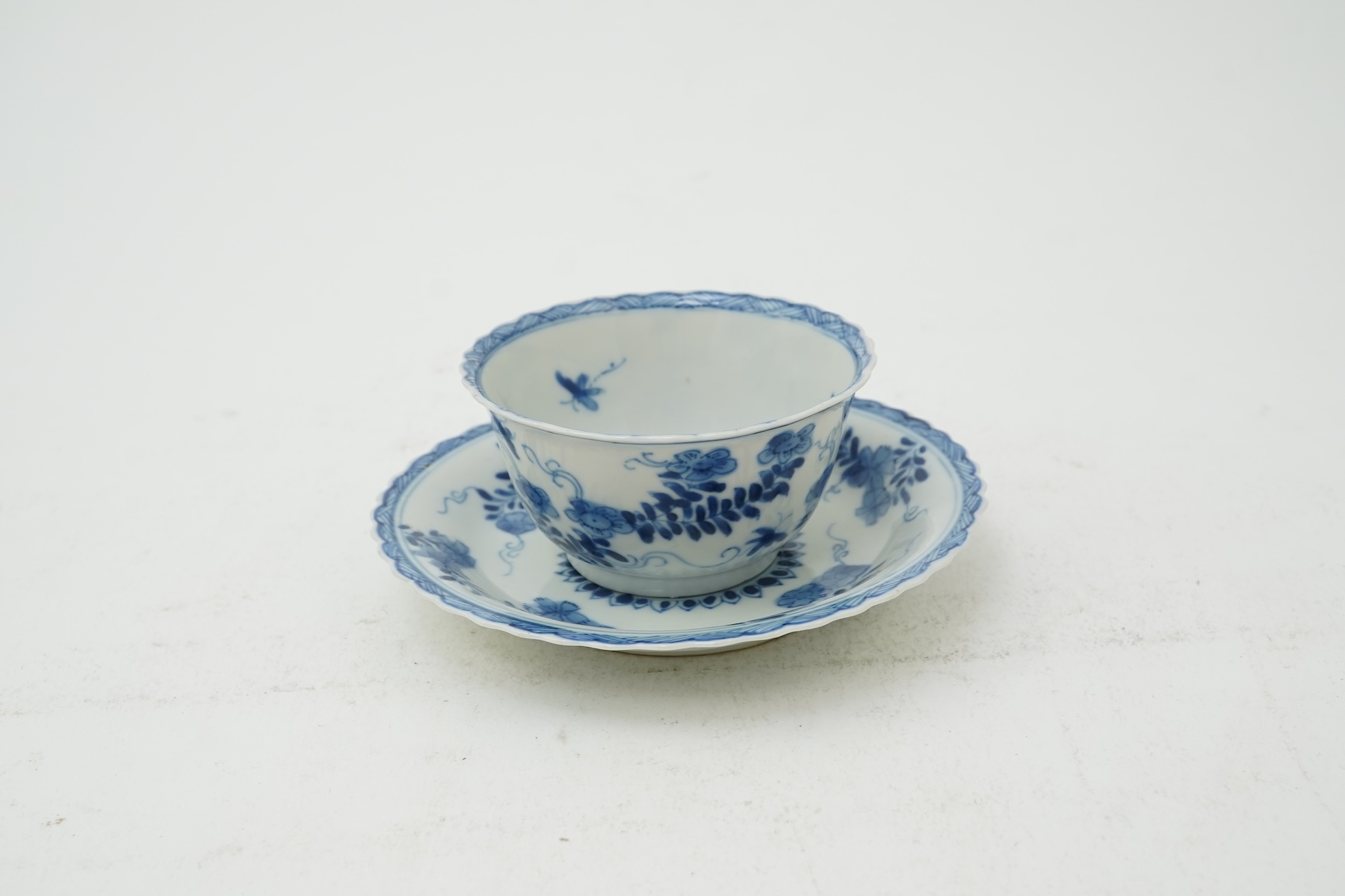 A Chinese blue and white tea bowl and saucer, Kangxi period